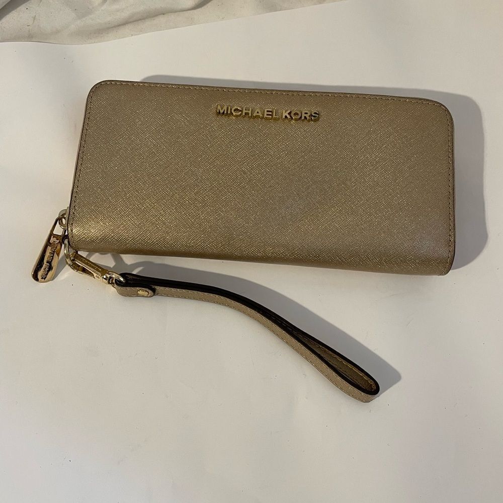 Michael Kors metallic gold zip up wallet or clutch.